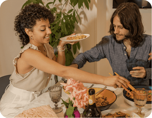 Couple enjoying a meal with fresh food
