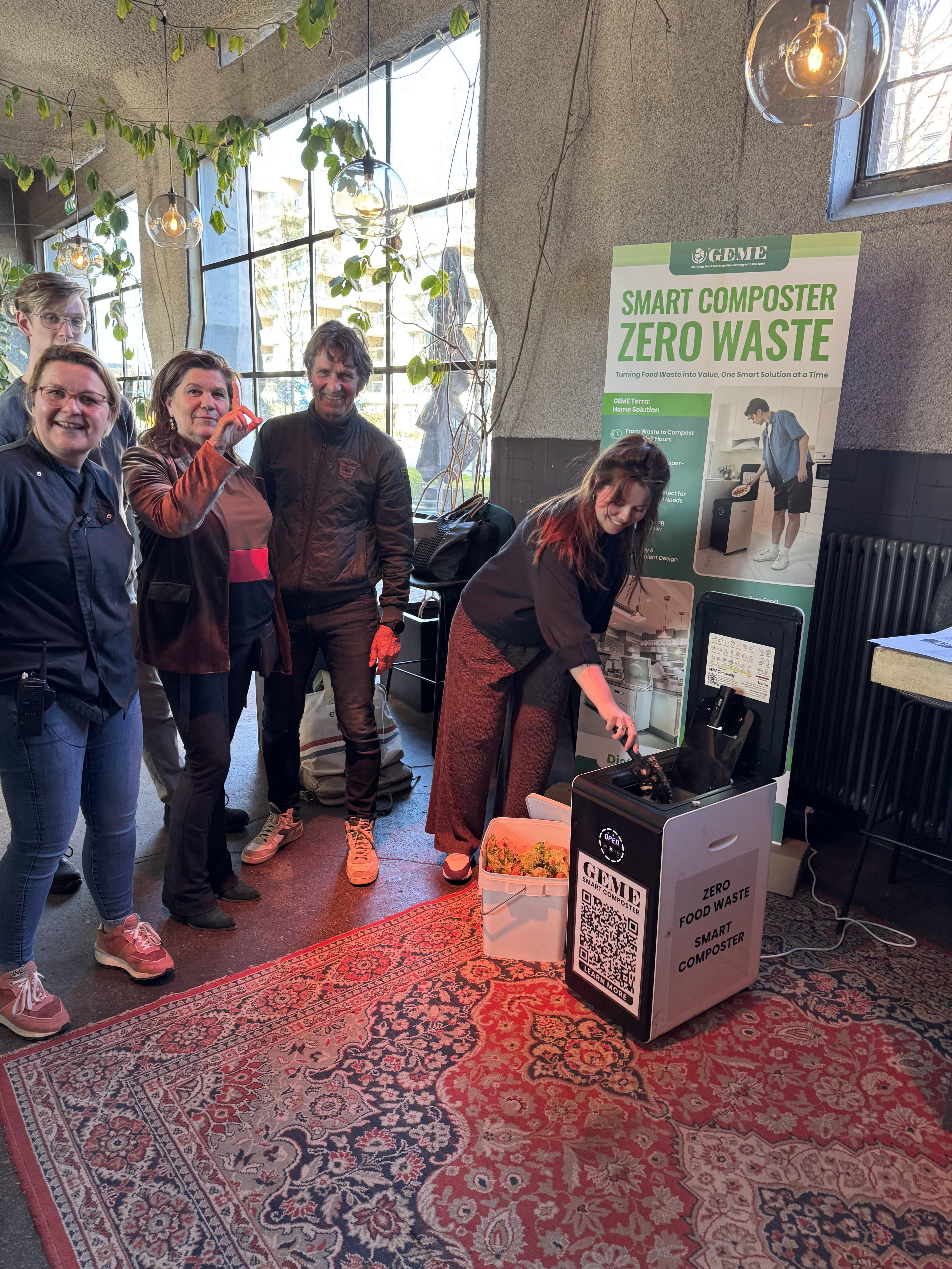 GEME team photo with the Smart Composter at the booth